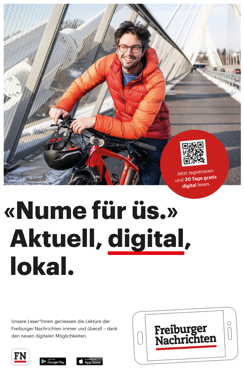 mann mit Fahrrad auf der Brücke in Freiburg auf Inserat.